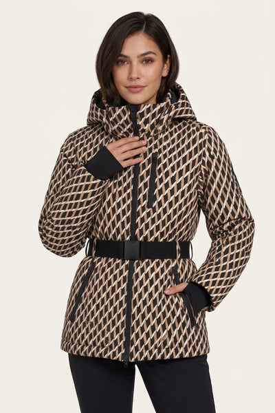 A woman modeling a hooded puffer jacket with a beige and black geometric pattern, a black belt, and black cuffs, set against a plain light beige background.